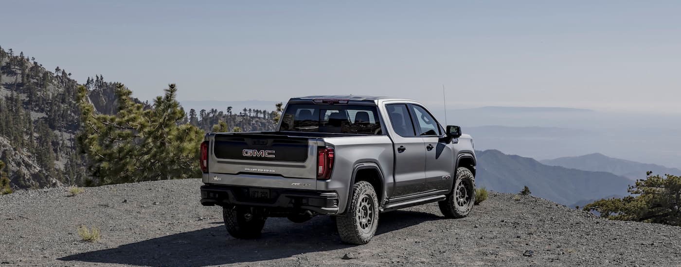 A grey 2025 GMC Sierra 1500 for sale from behind. 